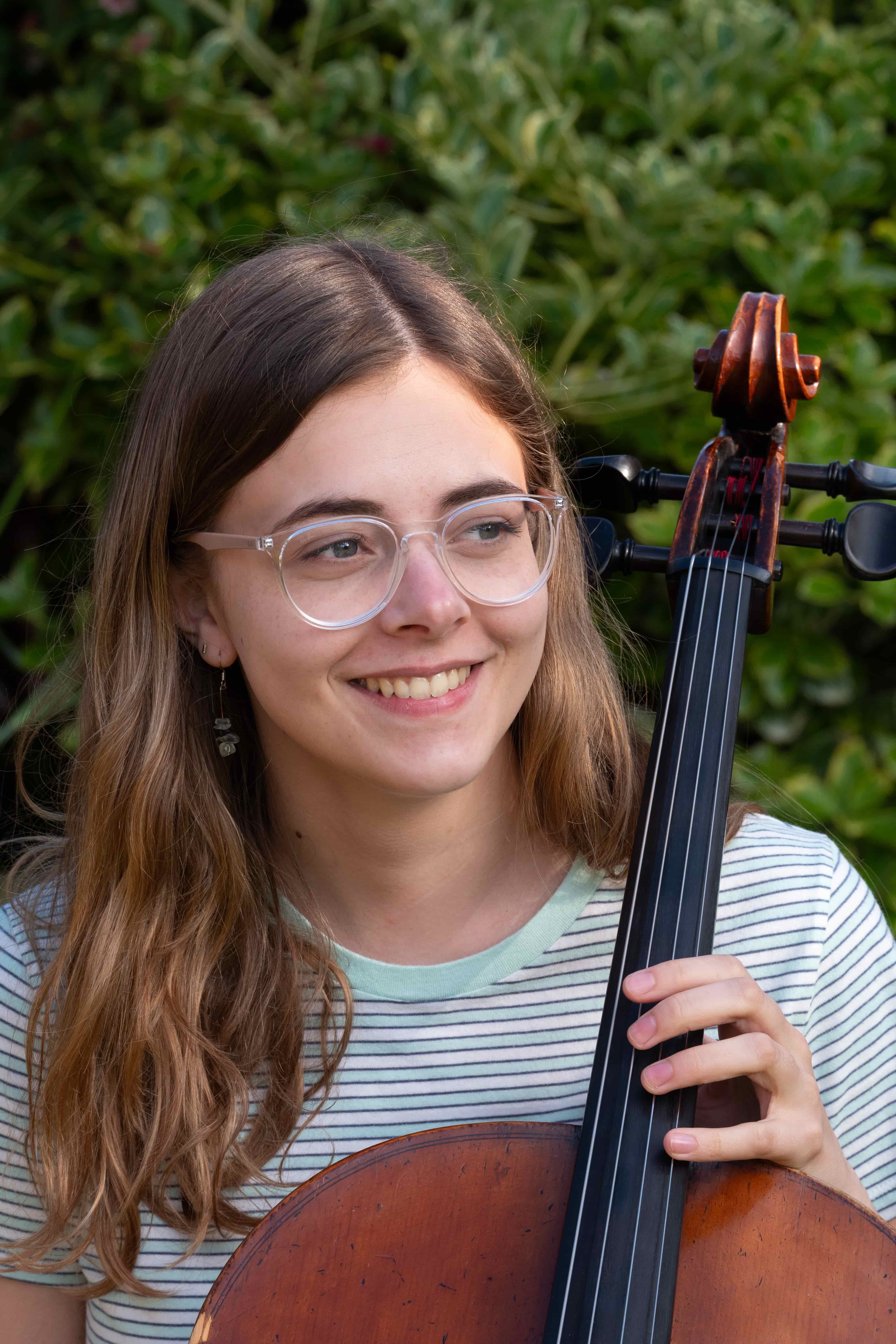 Sophie with her Cello outside, portrait
