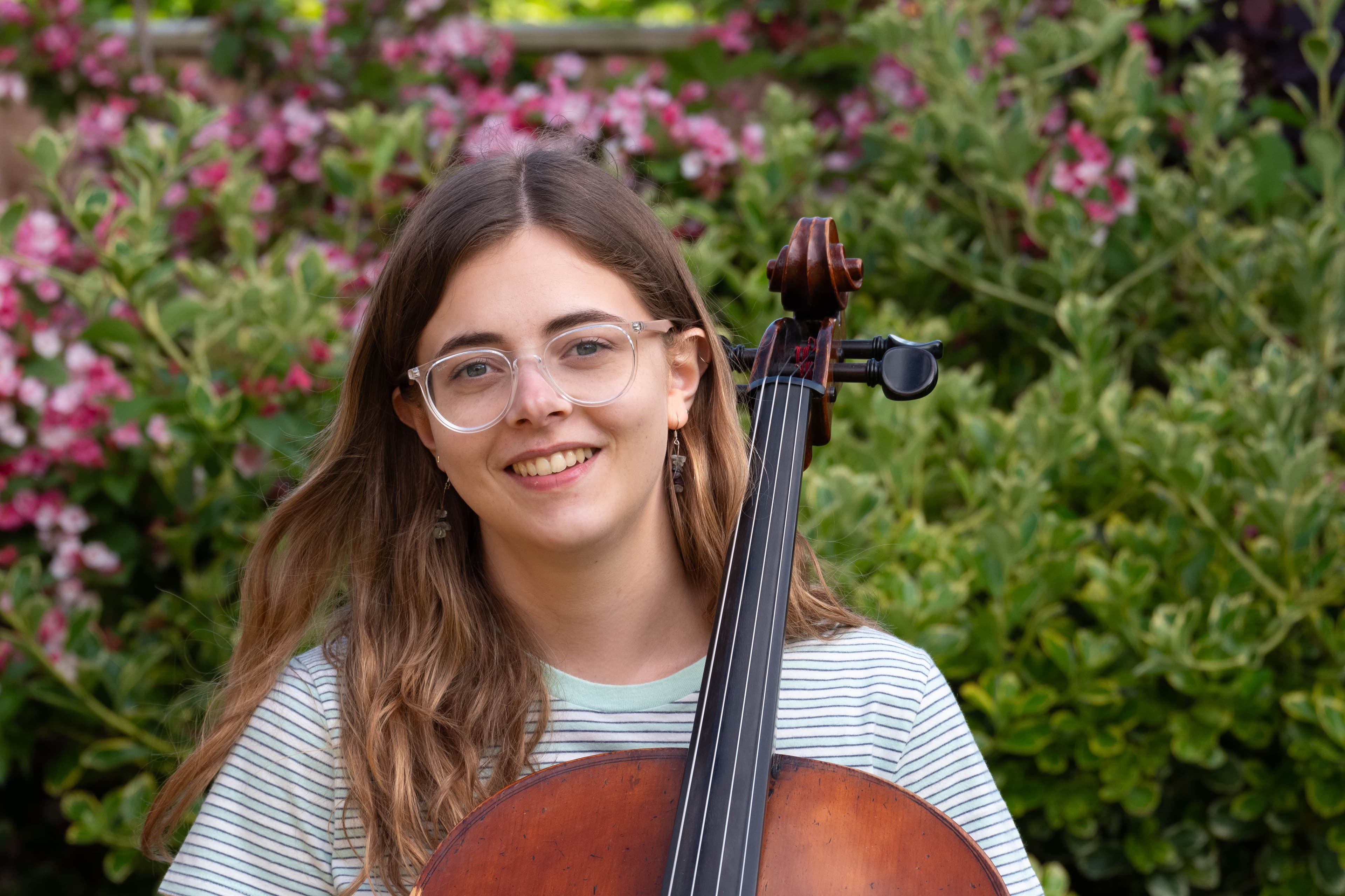 Sophie with her Cello outside, landscape